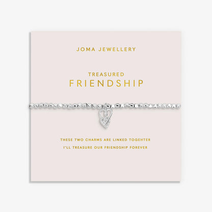 Silver bracelet with two interlinked hearts in silver and CZ, with a sentiment that reads 'Treasured Friendship'