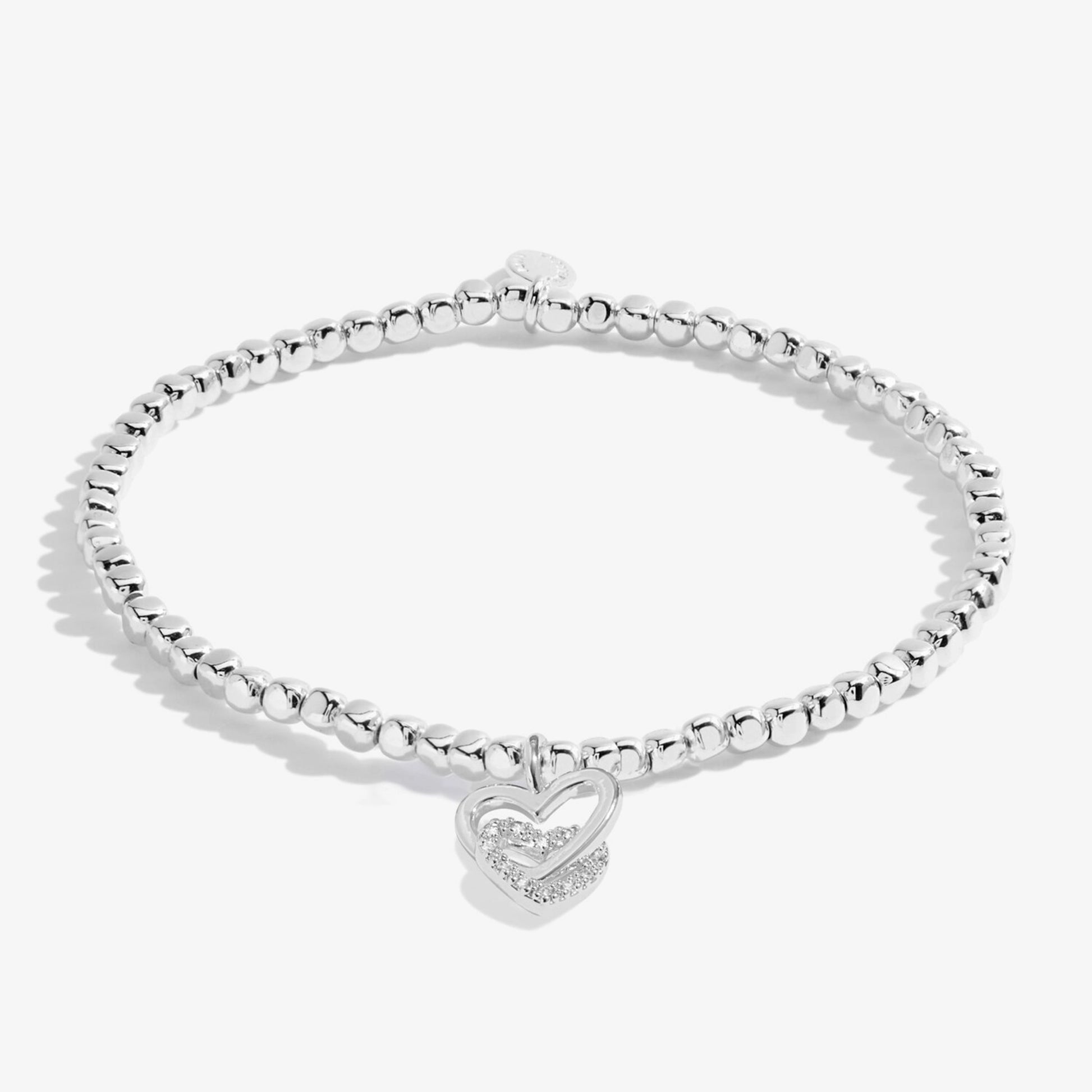 silver stretch beaded bracelet with a charm of two interlocked hearts and CZ stones