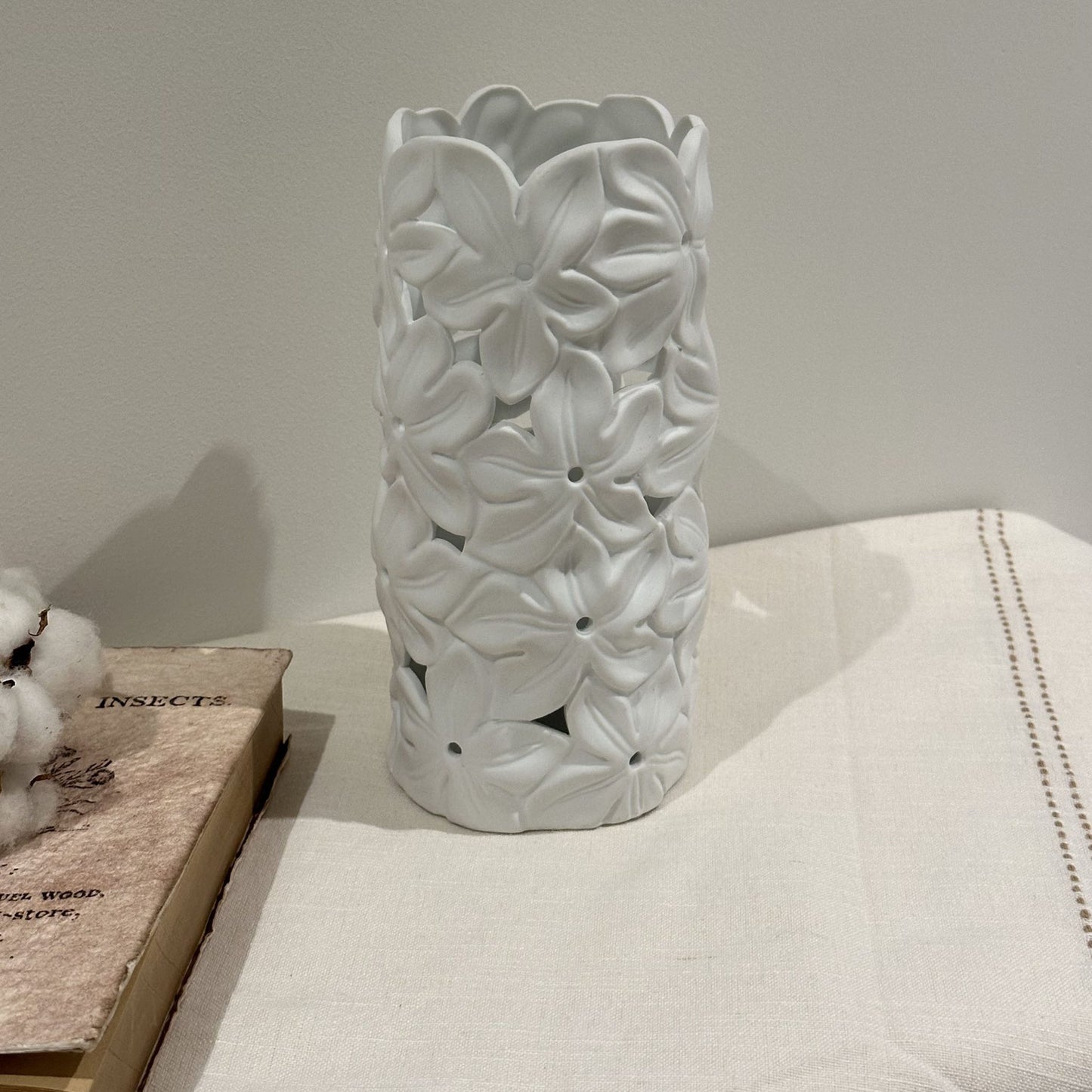 A porcelain lamp with 3D effect tropical frangipani flower design