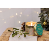 A gold tine candle with scandi style green pattern on brown paper in the scene 'Festive Wishes' - Lifestyle