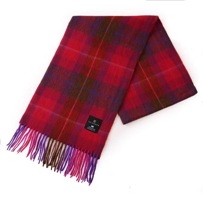 A bright pink and purple wool tartan scarf with fringe trim