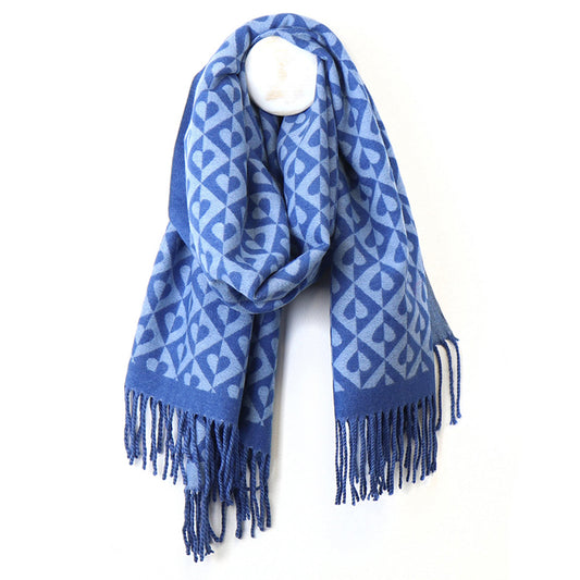 A blue scarf with twist tassel trim and a diamond heart pattern