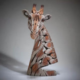 A textured and painted giraffe head bust sculpture front view