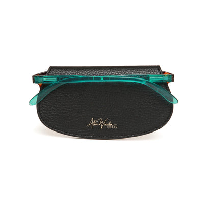 Faux leather black coloured glasses case with glasses inside and Alice Wheeler logo in gold