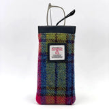 A Harris Tweed glasses sleeve in pink, green and blue check