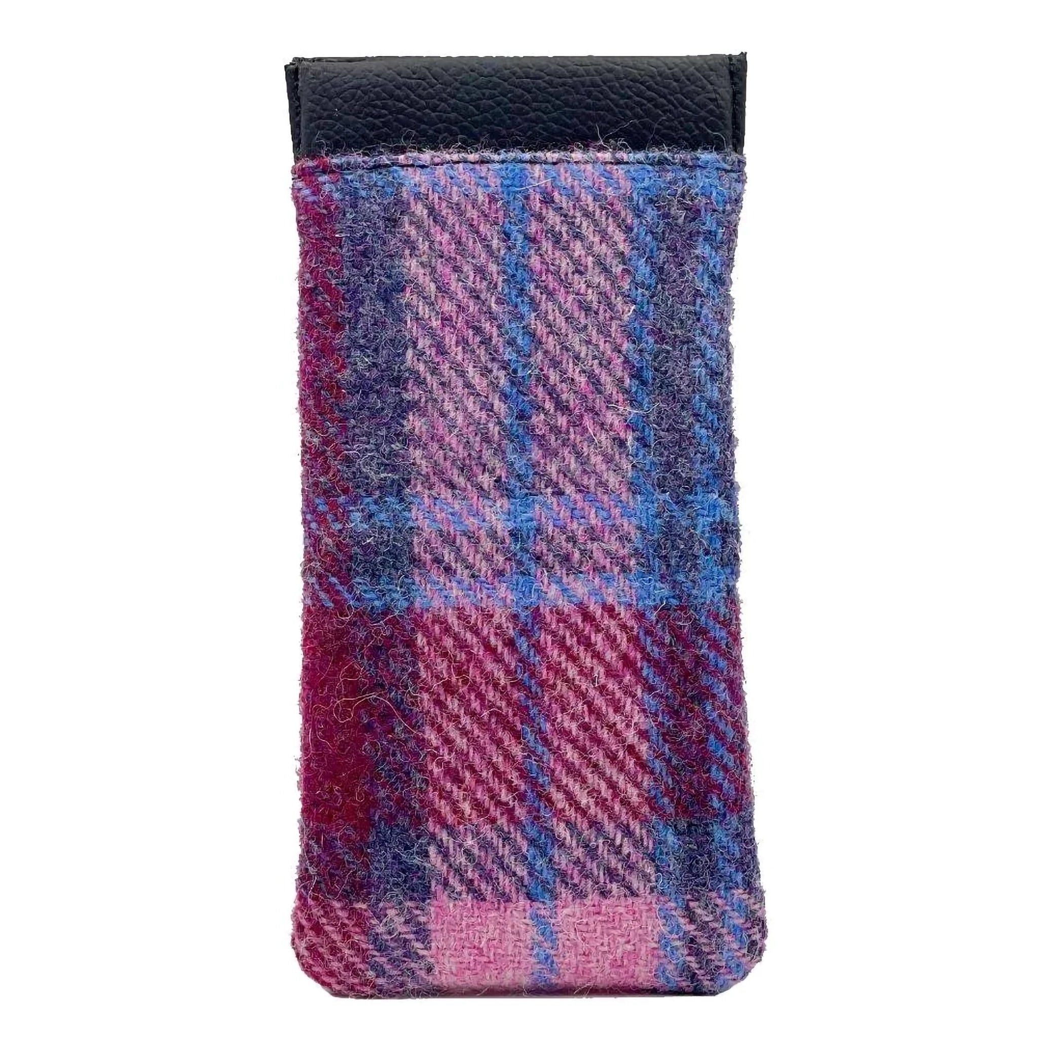 A Harris Tweed glasses sleeve in purple and pink check reverse