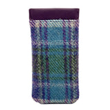 A Harris Tweed glasses sleeve in purple, green and blue plaid reverse
