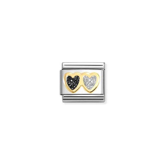A Nomination link charm featuring gold double hearts in silver and black glitter