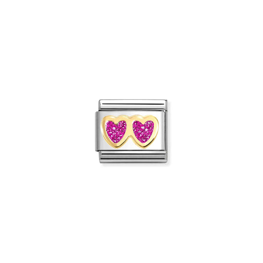 A Nomination link charm featuring gold double hearts in fuchsia pink glitter