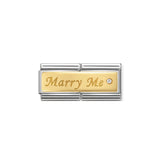 A Nomination charm double link featuring a gold plaque engraved with 'Marry Me' and set with a round cubic zirconia stone