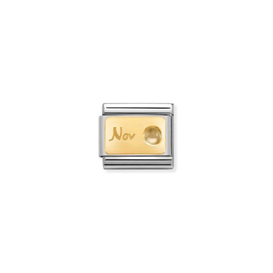 Nomination charm link featuring a gold plaque with engraved 'Nov' and a round citrine stone