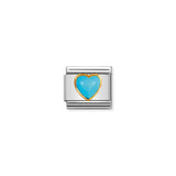 Nomination charm link featuring a heart shaped turquoise stone with gold surround