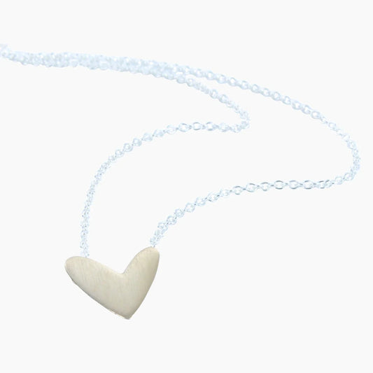 A matt textured gold stretched wide heart on a silver chain