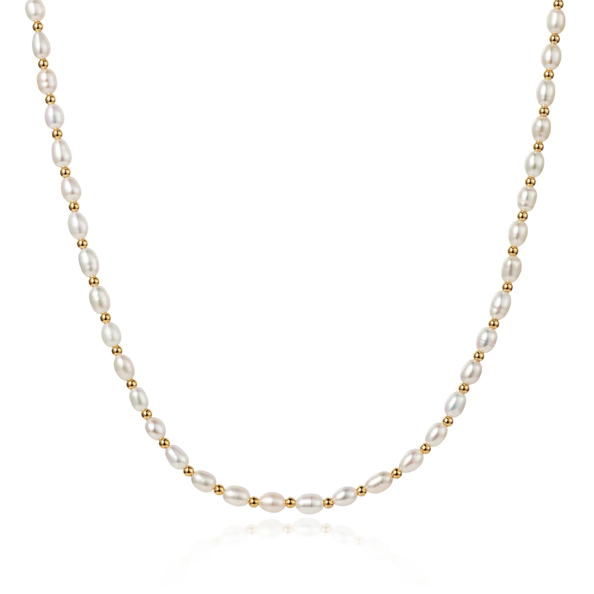 A white seed pearl necklace with gold spacers in 18k vermeil plating