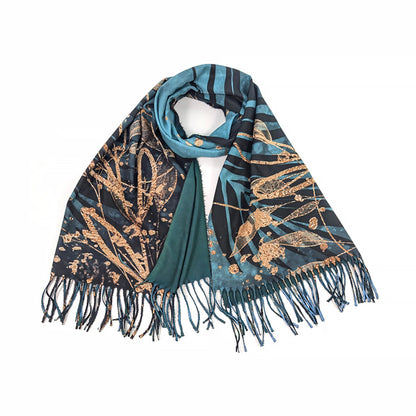 A teal blue pashmina tassel scarf with black and gold foil leaf design