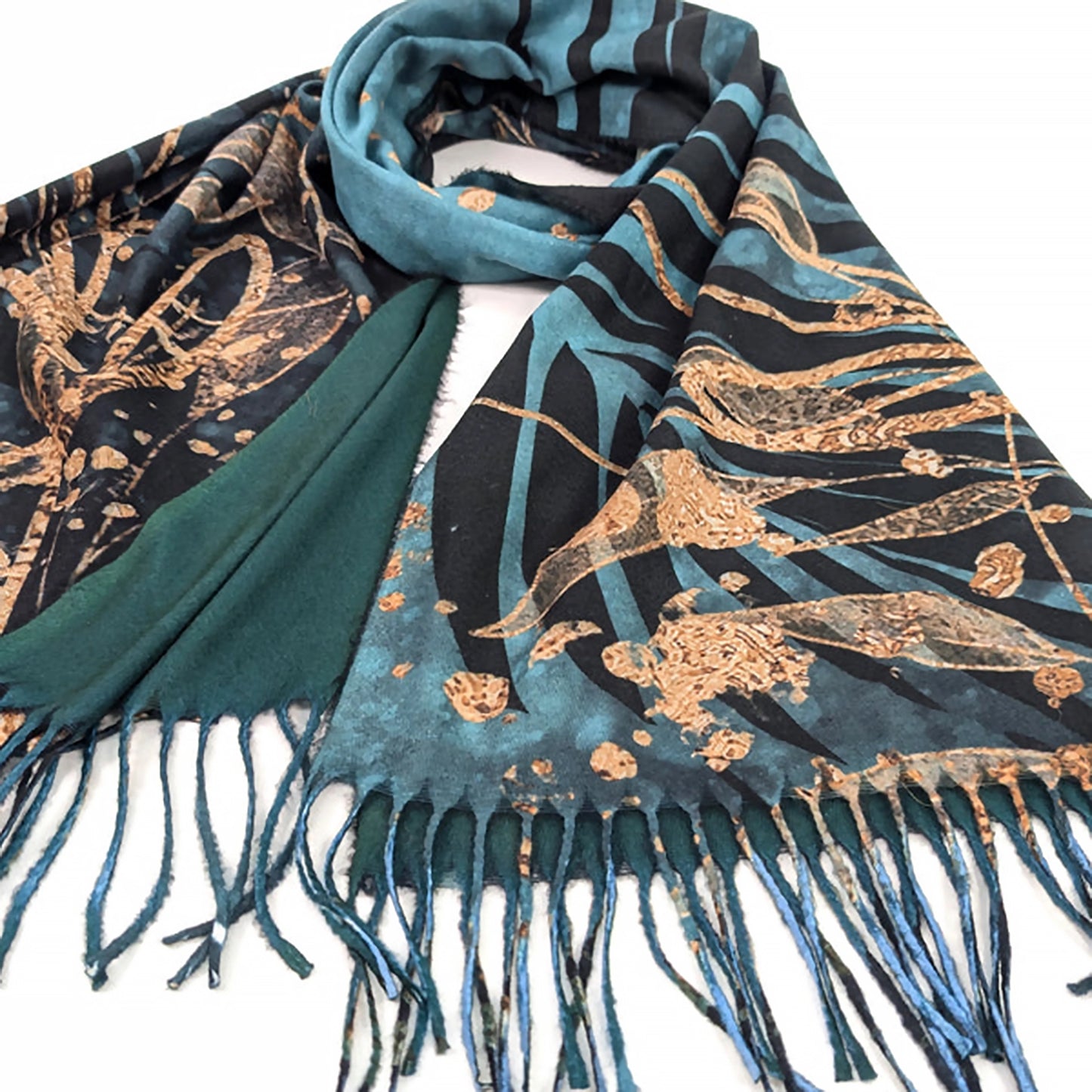 Detail of a teal blue pashmina tassel scarf with black and gold foil leaf design