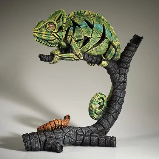 A textured and painted green chameleon on log sculpture side view