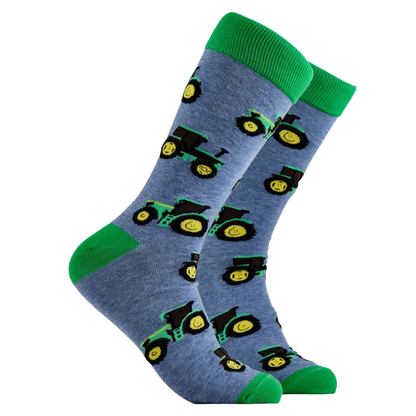 Pair of blue and green farming socks with tractor design