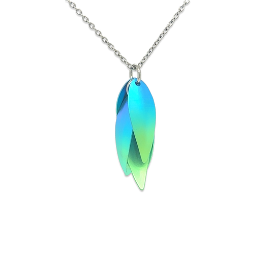 A titanium drop flower shaped pendant with green and blue ombre