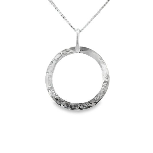 Large open hammered circle pendant on silver chain