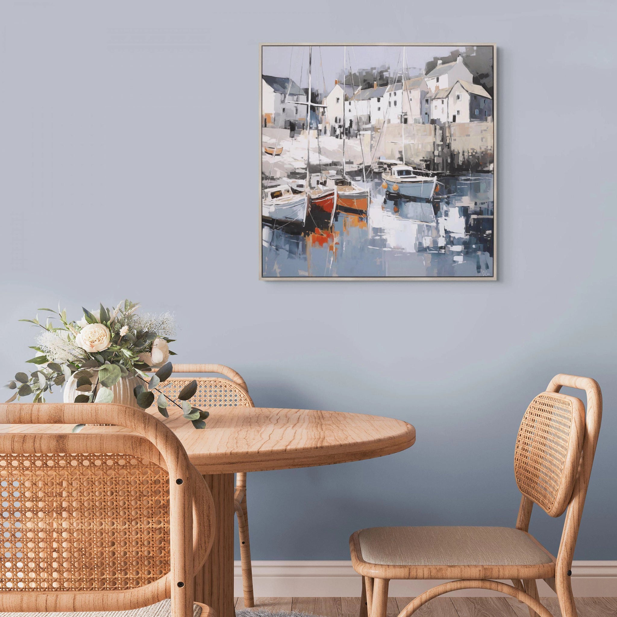 Framed canvas of a traditional coastal scene created using broad brush strokes in a muted colour palette hanging