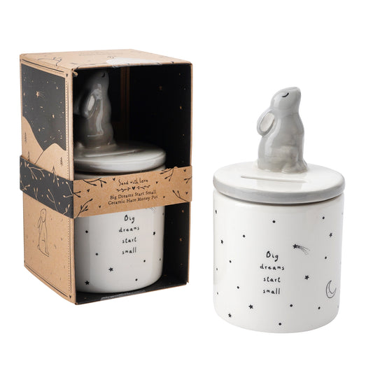 A ceramic cylinder money jar with a hare and a star design