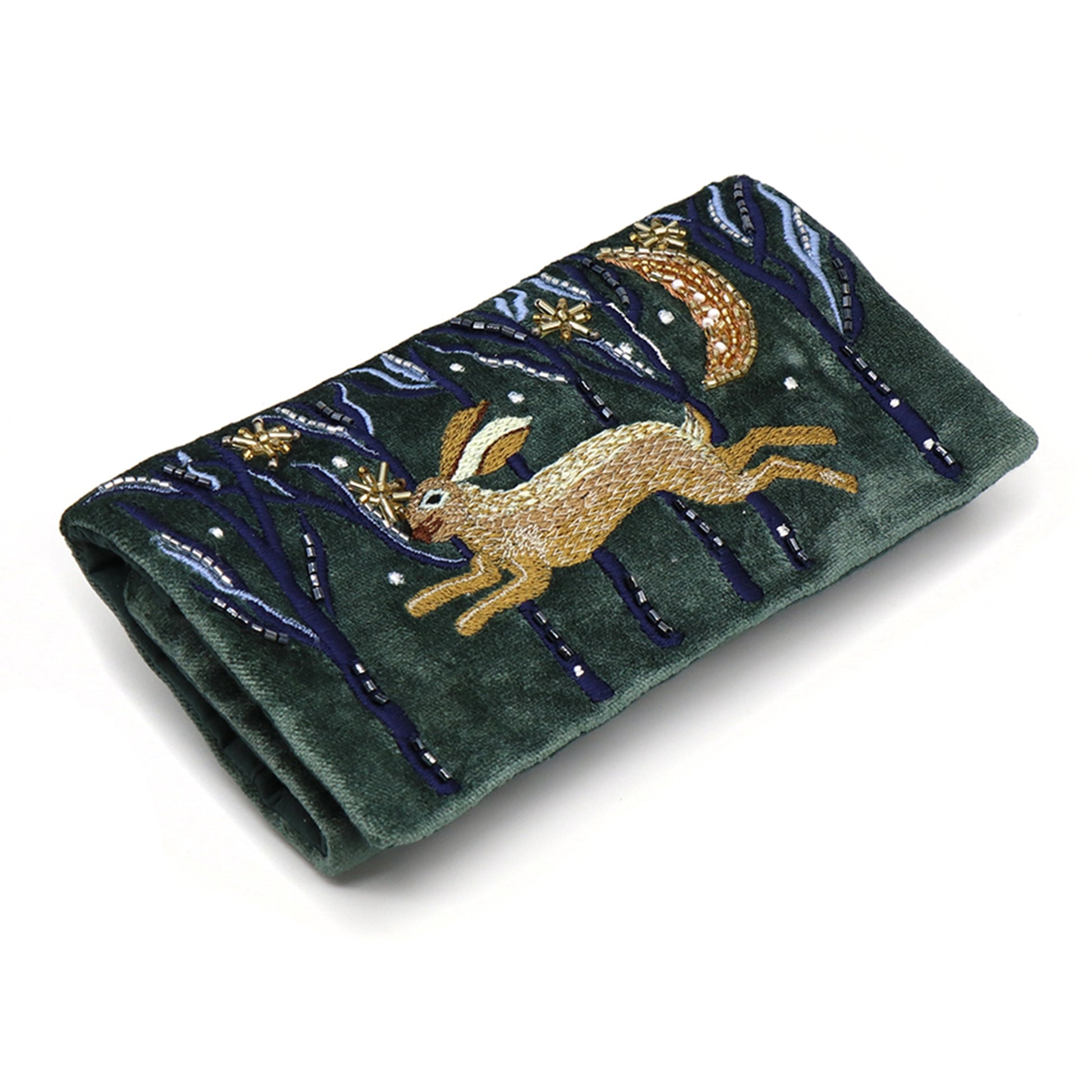 A dark green velvet jewellery roll with an embroidered and beaded hare design