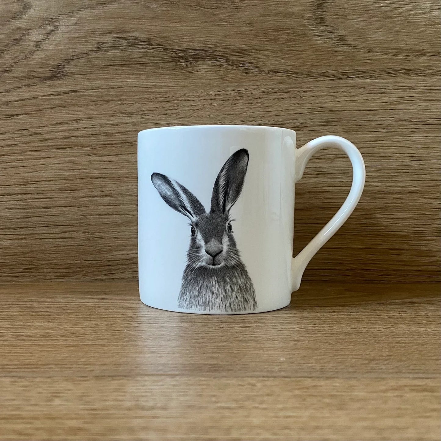 White mug with grey hare illustration