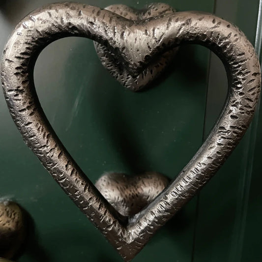 Heart shaped door knocker in gunmetal with textured details