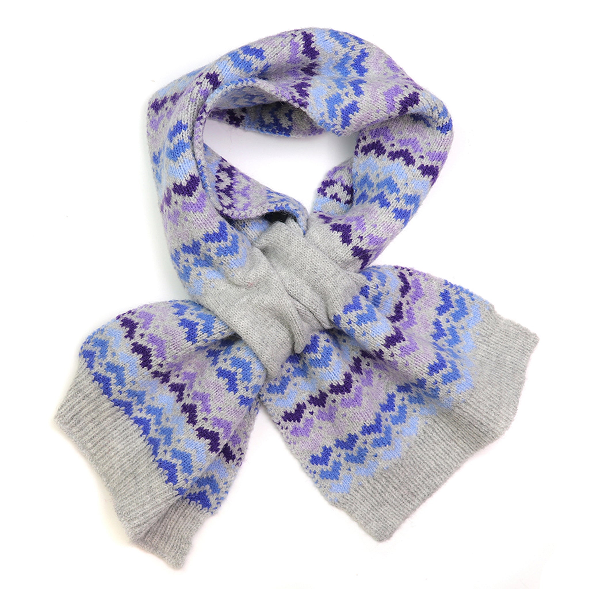 A grey knitted pull-through scarf with blue and purple repeat heart pattern