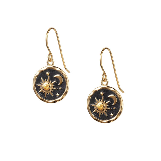 Gold coin shaped drops with black centres and a sun and moon motif set with orange citrine stones