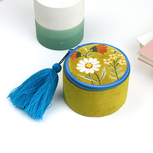 A chartreuse velvet zip up trinket jewellery box with embroidered flowers