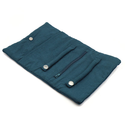 Open dark teal velvet jewellery roll with two snap ring rolls and a zip pocket