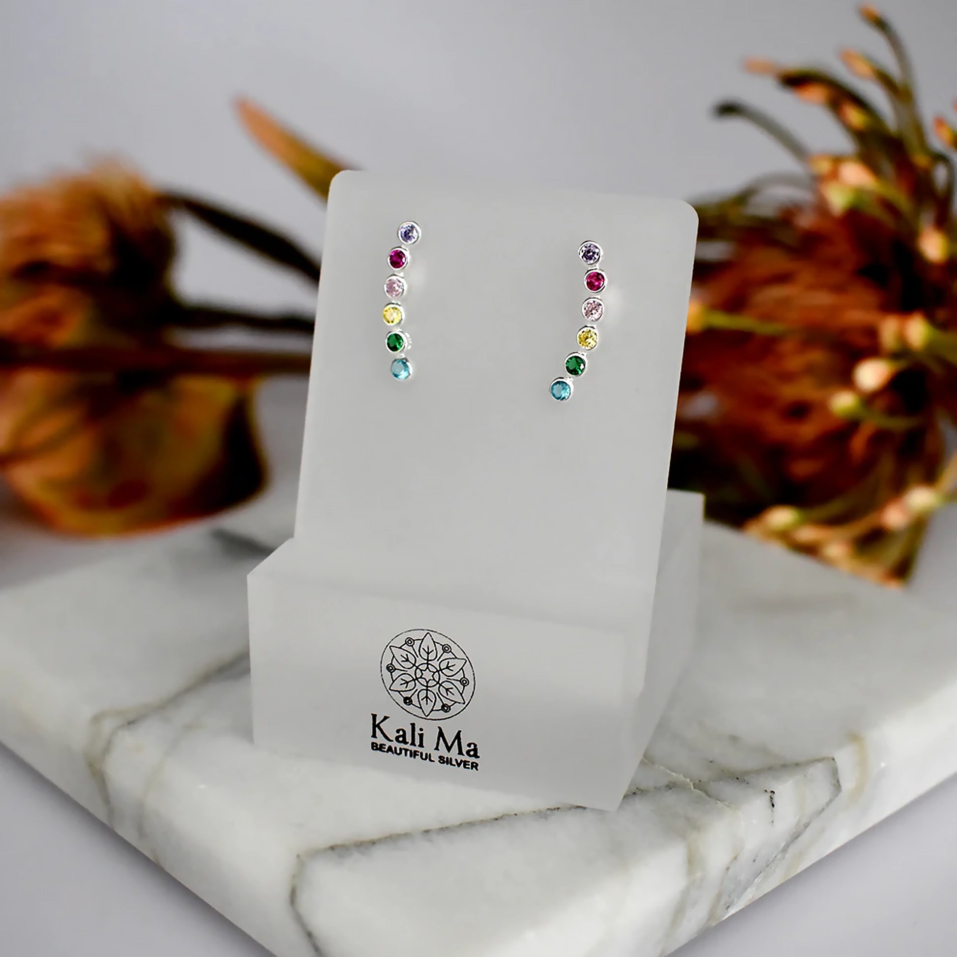 Silver climber stud earrings with round rainbow coloured CZ stones