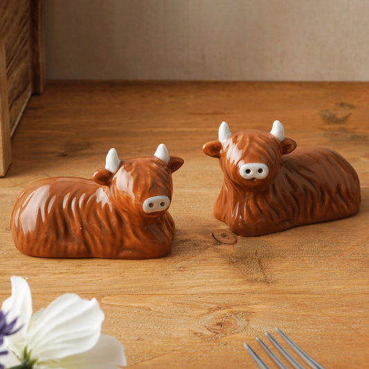 A pair of ceramic Highland cow salt & pepper shakers lifestyle