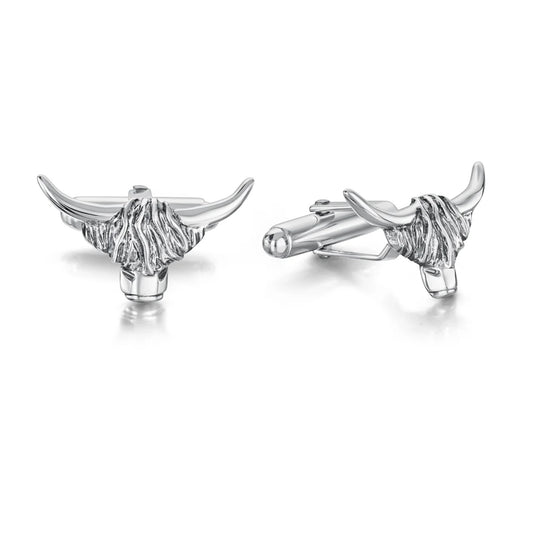 A pair of silver cufflinks shaped like Highland cow heads with simple T-bar clasps and oxidised details