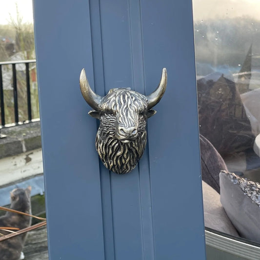 Antique brass coloured Highland cow door knocker