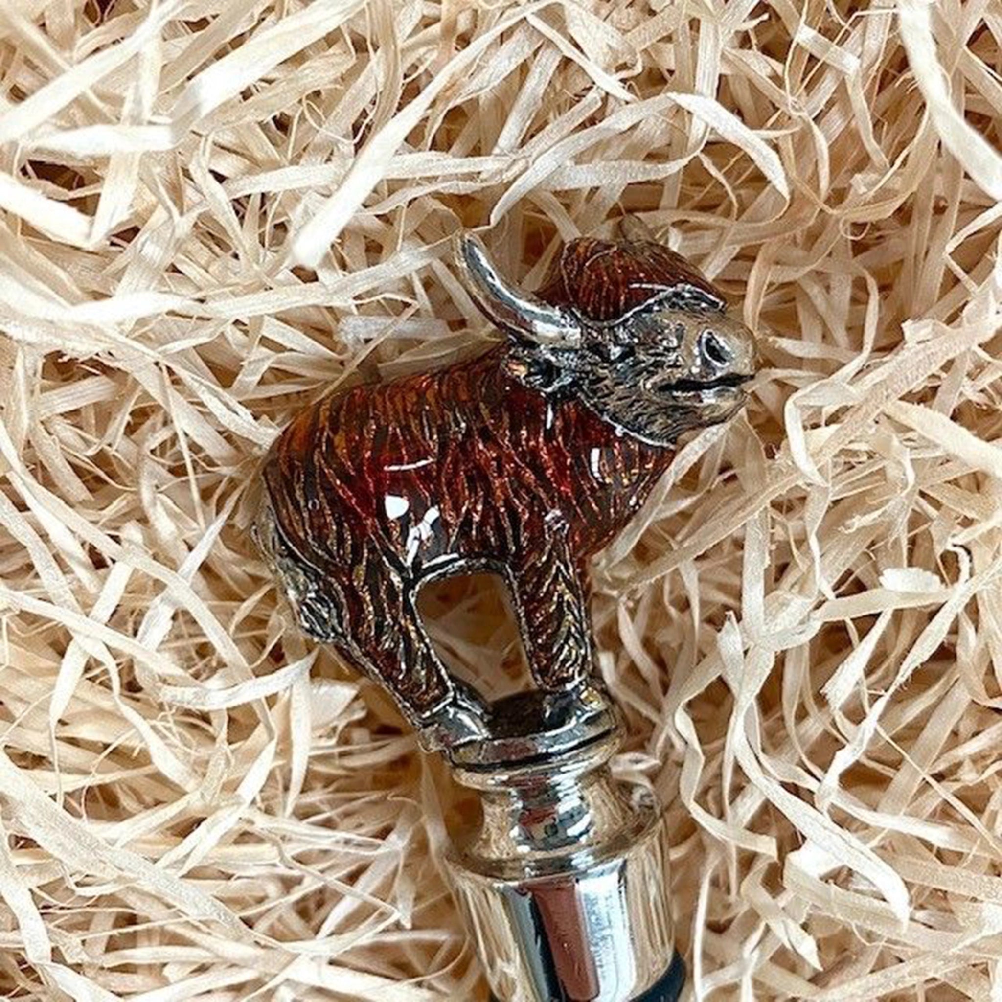 Top of an enamelled bottle stopper with a Highland cow top