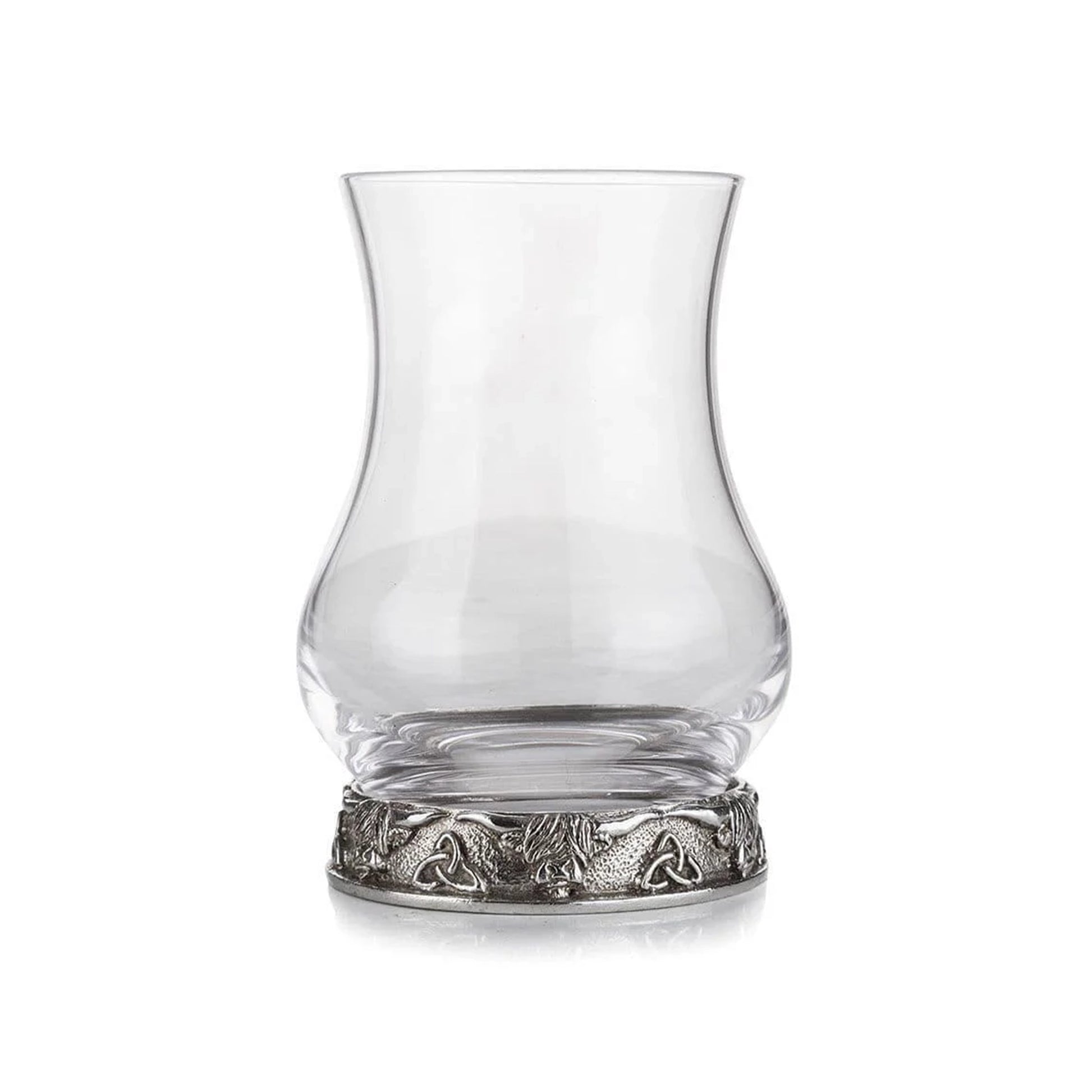 A whisky glass with a pewter base decorated with Highland cows and trinity knots