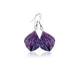 A pair of curved aluminium drop earrings with abstract and brightly coloured modern design print