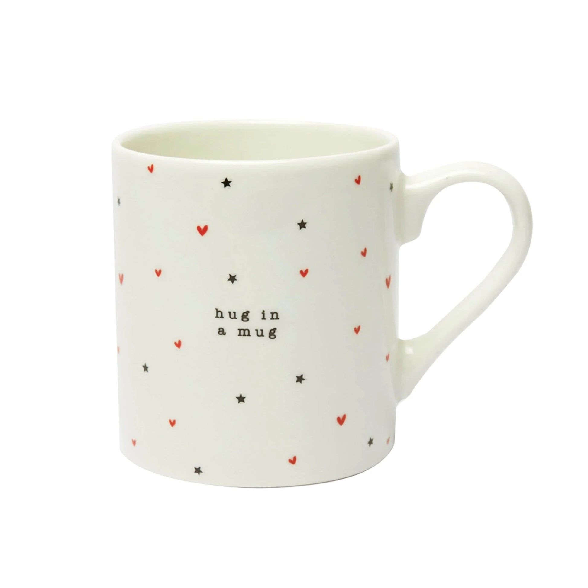 A mug with black and red hearts and stars wrap around print and the words 'hug in a mug'