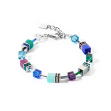 A steel bracelet featuring a variety of cube shaped stones in blue and purple