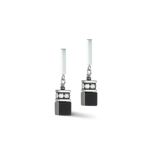 A pair of steel drop earrings featuring cube shaped black onyx and white rhinestones