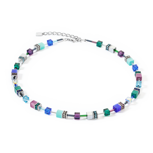 A steel necklace featuring a variety of cube shaped stones in blue and purple