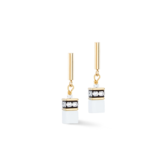A pair of gold steel earrings with white cube shaped stone