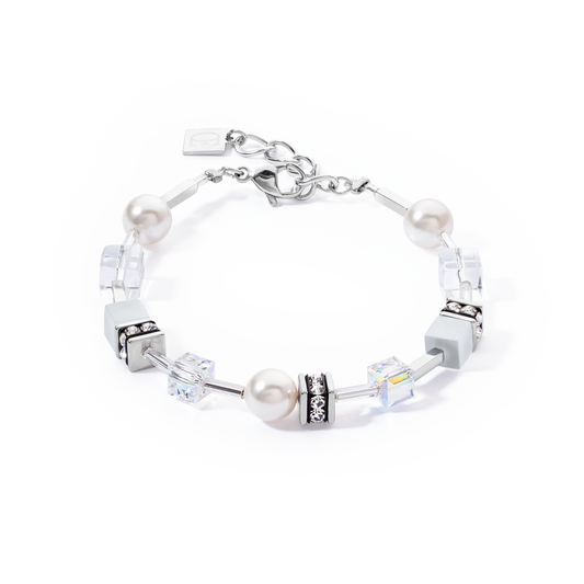 A steel bracelet featuring white pearls and cube beads