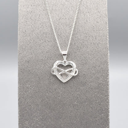 Silver pendant with infinity sign interlocking an open heart set with CZ stones