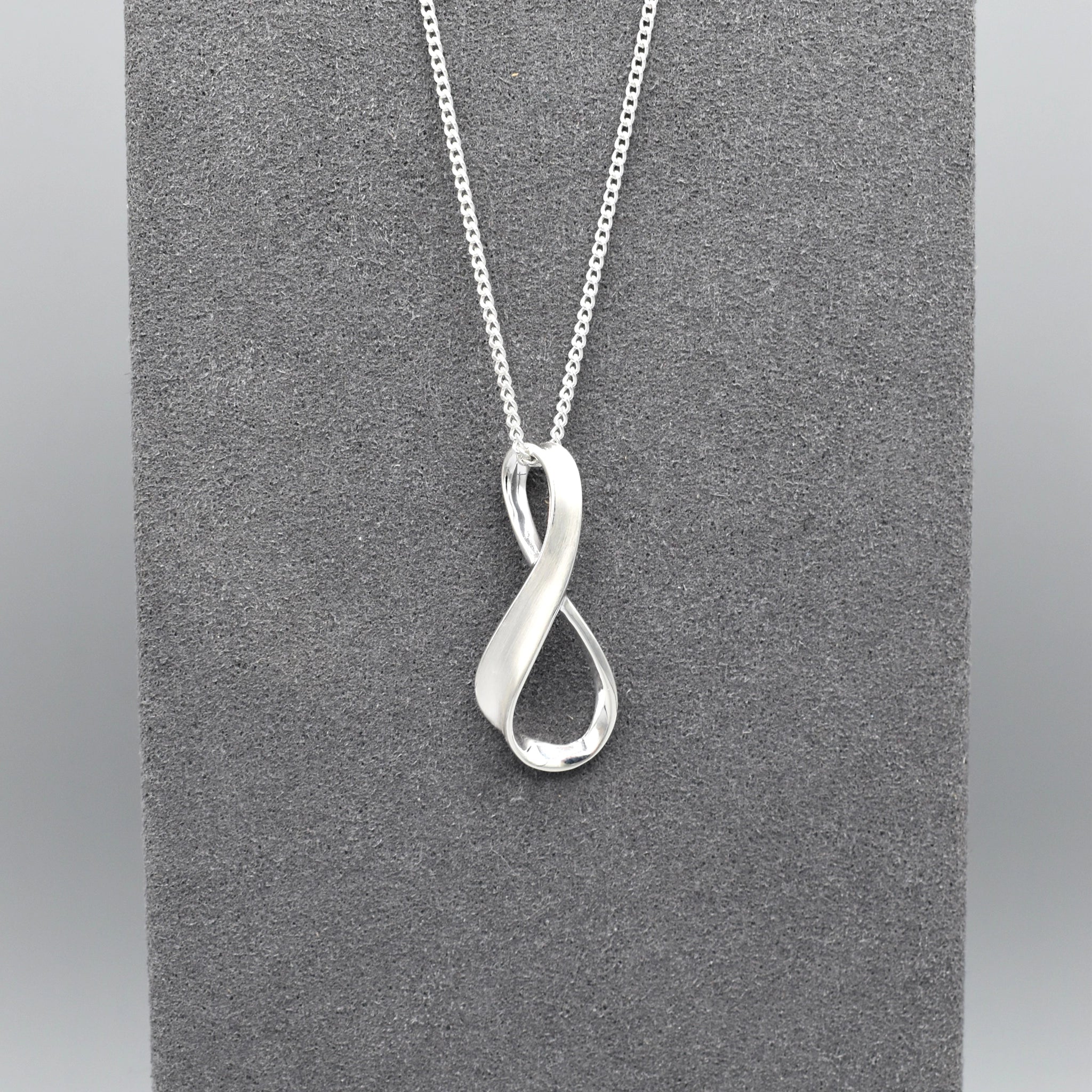 J Silver Infinity Twist Pendant | Juniper Aberdeen