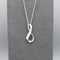 A silver matt & shiny infinity symbol shaped pendant