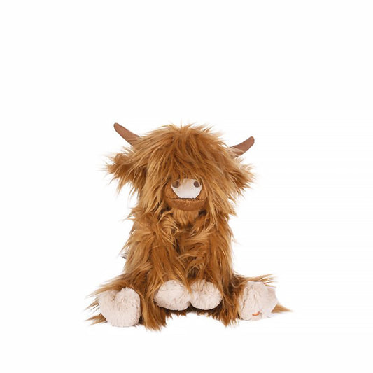 A stuffed Highland cow plush toy with the Wrendale logo embroidered on the bottom of its foot